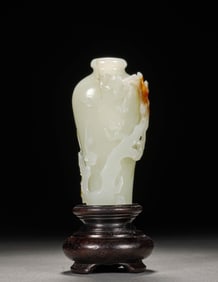 A WHITE JADE 'PLUM BLOSSOM' VASE