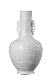 A WHITE-GLAZED 'DRAGON-AND-PHOENIX' VASE