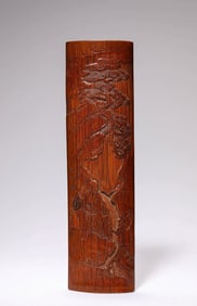 A BAMBOO 'FIGURE' WRIST REST