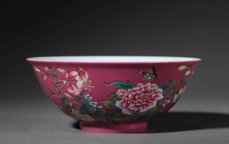 A PINK-GROUND FAMILLE-ROSE 'BUTTERFLY-AND-FLOWER' BOWL