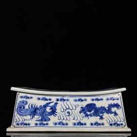 A BLUE AND WHITE 'DRAGON, PHOENIX AND FLOWERS' PORCELAIN PILLOW
