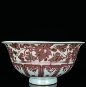 A UNDERGLAZED RED 'INTERLOCKING FLOWERS AND MANDARIN DUCKS' BOWL