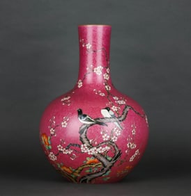 A RUBY-RED GROUND FAMILLE ROSE  'MAGPIE ON PLUM' GLOBULAR VASE