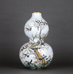 A FAMILLE ROSE 'MAGPIE ON PLUM' GOURD-SHAPED VASE