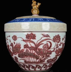 A UNDERGLAZED RED 'MANDARIN DUCKS' COVERED JAR