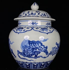 A BLUE AND WHITE 'LION PLAYING WITH BROCADE BALL' COVERED JAR