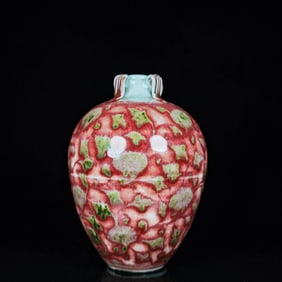 A UNDERGLAZED RED 'PLUCKED BRANCH FLOWERS' FOUR-LUGGED POT