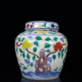 A DOUCAI 'FLOWERS AND BIRDS' COVERED JAR