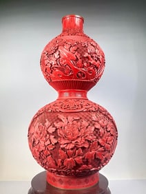 A COPPER-BODY CARVED RED LACQUER 'FLORAL' GOURD-SHAPED VASE