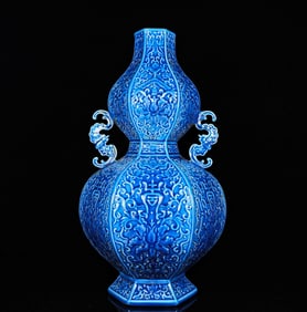 A BLUE GLAZED CARVED 'BAT, SHOU AND FLOWERS' GOURD-SHAPED VASE