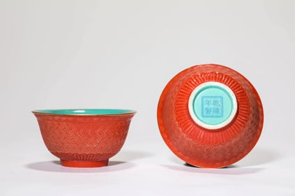 A PAIR OF CARVED LACQUER-STYLE BOWLS
