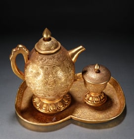 A SET OF GILT-DECORATED-BRONZE TEA UTENSILS