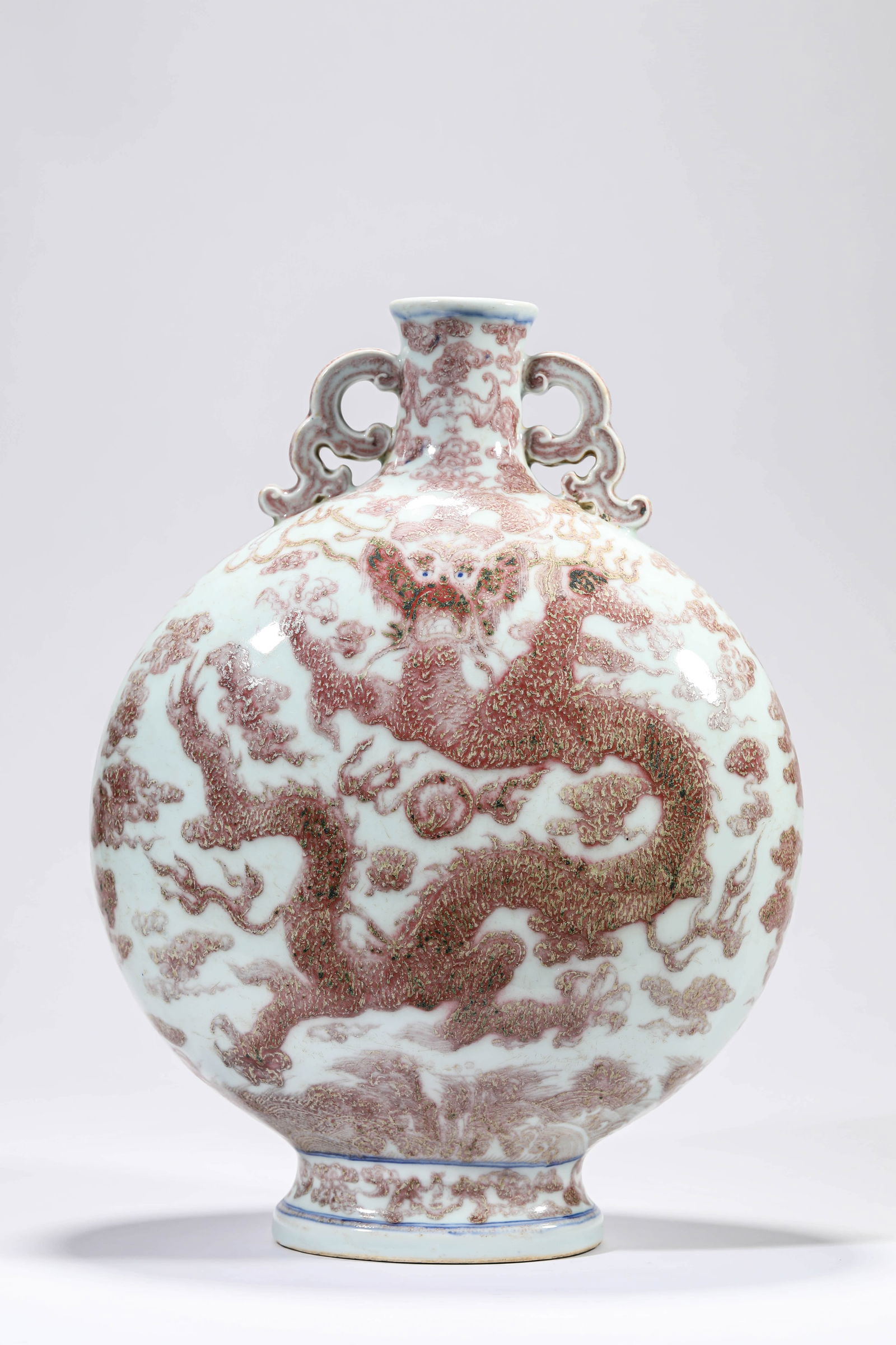 AN UNDERGLAZE-RED 'DRAGON-AND-CLOUD' MOONFLASK: AN UNDERGLAZE-RED 'DRAGON-AND-CLOUD' MOONFLASK Dimensions: Length: 26 cm (10.24 in) x Width: 14 cm (5.51 in) x Height: 37.8 cm (14.88 in). All measurements are approximate.