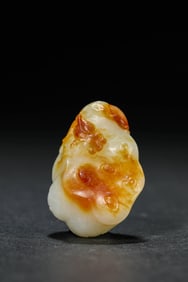 A JADE 'FISH PLAYING WITH LOTUS POD' CARVING