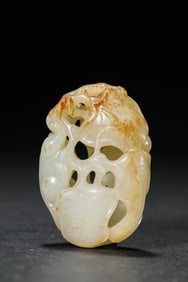 A JADE CARVING OF 'SQUIRREL AND GRAPES'