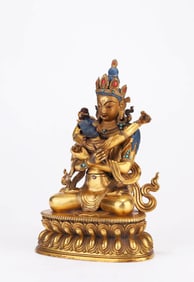 A GILT-BRONZE FIGURE OF BUDDHA