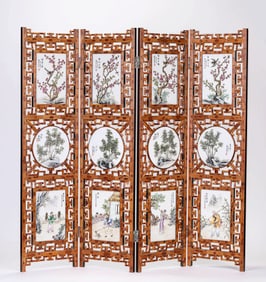 A WOODEN SCREEN WITH PORCELAIN PANELS