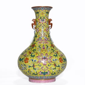 A QIANLONG PERIOD YELLOW-GROUND FAMILLE ROSE DOUBLE-EAR VASE