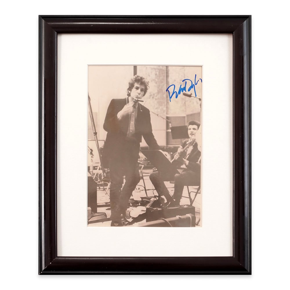 BOB DYLAN SIGNED GELATIN SILVER PHOTOGRAPH: Image Dimensions: 9 7/8 x 6 7/8 in (25 x 17.6 cm) Provenance and Authentication: This collectible has undergone a rigorous forensic evaluation. The signatures were carefully analyzed across multiple c