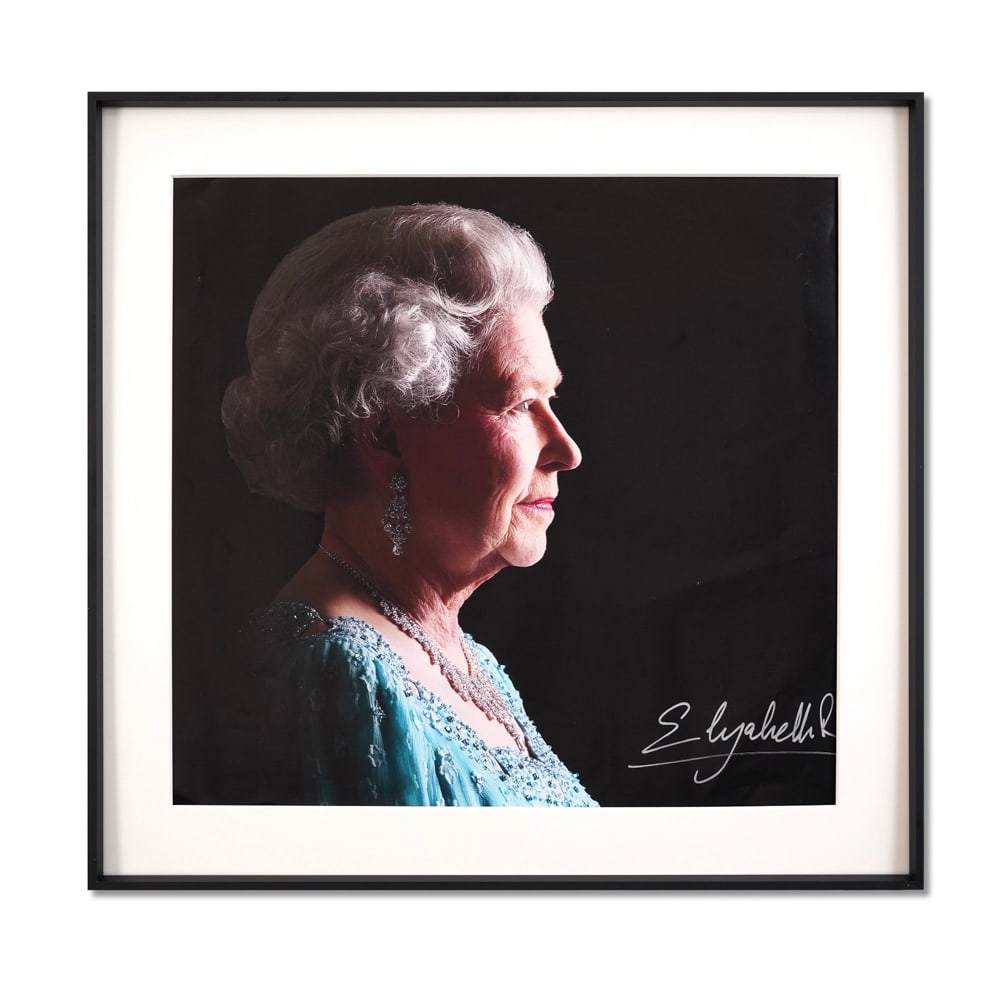 QUEEN ELIZABETH II SIGNED POSTER: Sight Size: 17 5/8 x 16 5/8 in (44.7 x 42.2 cm) Frame Size: 21 7/8 x 21 in (55.7 x 53.2 cm) Presented here is an exceptionally rare signed portrait of Queen Elizabeth II, featuring Her Majesty in prof