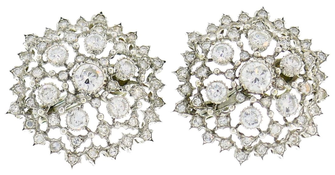 DIAMOND FLORAL EARRINGS: DIAMOND FLORAL EARRINGS Description: A pair of white metal floral-form earrings set throughout with white stones. The images show the front and reverse sides of the earrings.