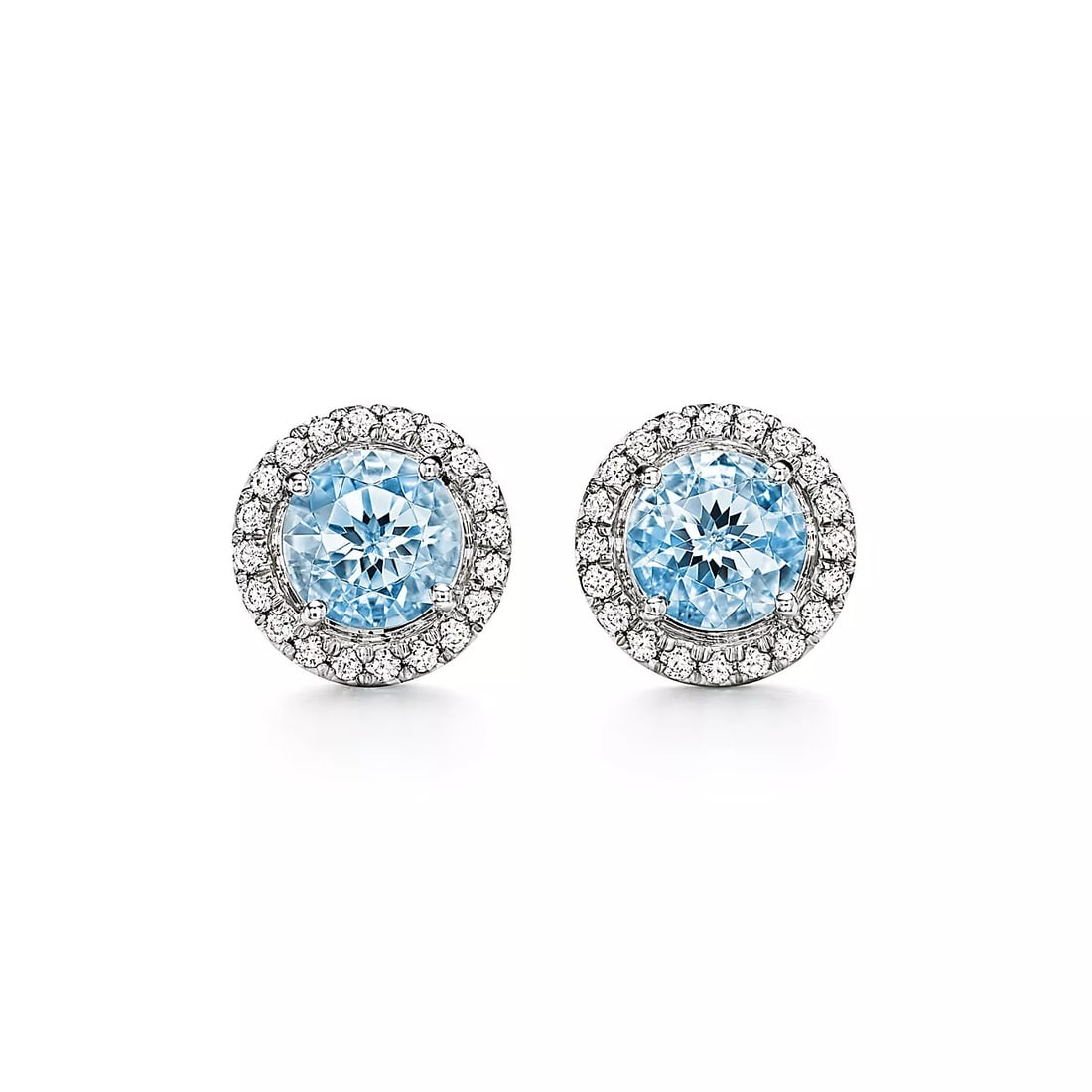 BLUE SAPPHIRE AND DIAMOND STYLE CROSS MOTIF STUD EARRINGS: BLUE SAPPHIRE AND DIAMOND STYLE CROSS MOTIF STUD EARRINGS Description: The lot consists of a pair of stud earrings crafted in white metal and designed in a cross-inspired motif; each earring features 