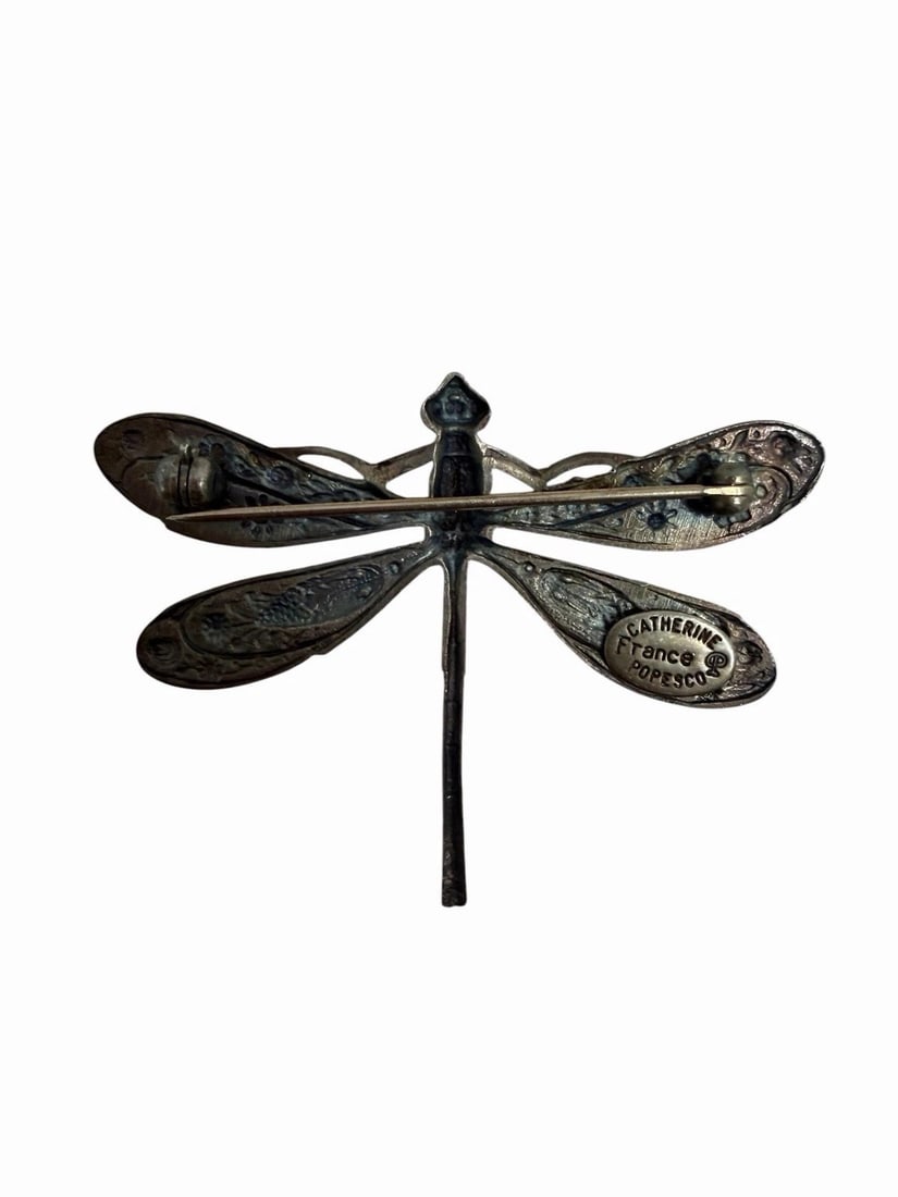 CATHERINE POPESCO DRAGONFLY BROOCH ART NOUVEAU STYLE ENAMEL GOLD ACCENTS: CATHERINE POPESCO DRAGONFLY BROOCH ART NOUVEAU STYLE ENAMEL GOLD ACCENTS Description: The Catherine Popesco Dragonfly Brooch is a beautifully crafted piece of vintage jewelry with an Art Nouveau style