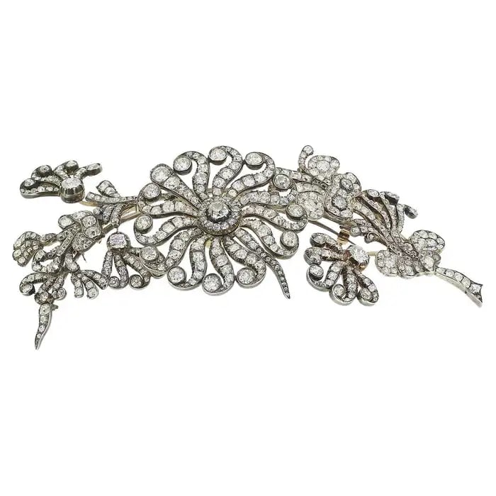ANTIQUE DIAMOND TREMBLANT CORSAGE SPRAY BROOCH: ANTIQUE DIAMOND TREMBLANT CORSAGE SPRAY BROOCH Description: 326/5000This is a fine piece of jewelry from the early Victorian era. The exquisite floral and palm leaf patterns are adorned with numerous 
