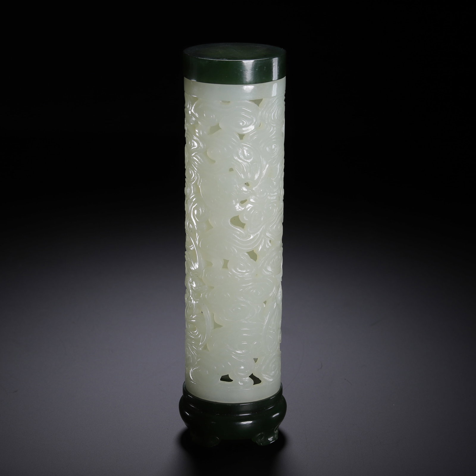 A HETIAN JADE INCENSE TUBE: A HETIAN JADE INCENSE TUBE Dimensions: Dimensions: Length: 4 cm (1.57 in.), Width: 4 cm (1.57 in.), Height: 15.2 cm (5.98 in.). Weight: 190 g. All measurements are approximate.