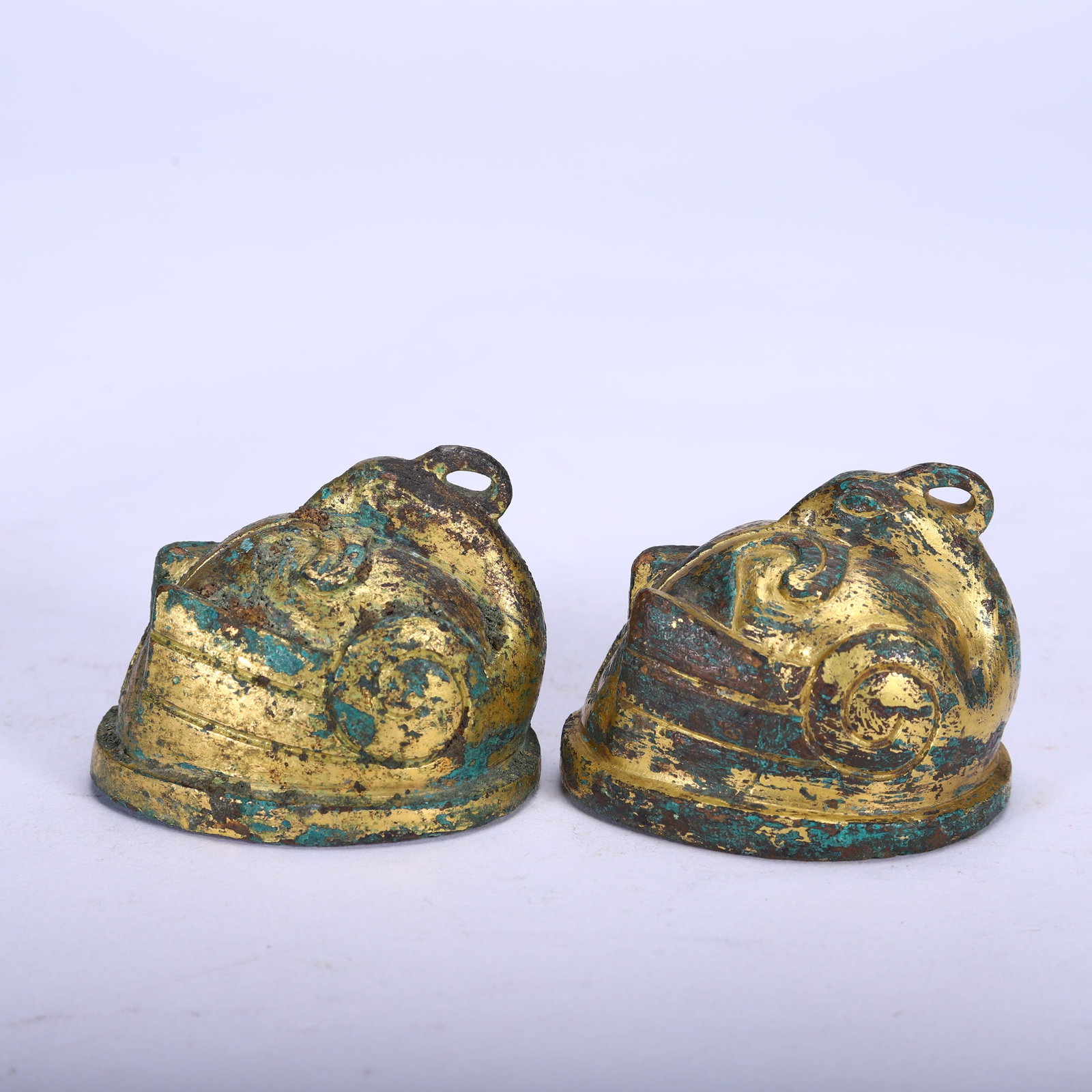 A GILT-BRONZE ORNAMENT: A GILT-BRONZE ORNAMENT Dimensions: Dimensions: Length: 5.5 cm (2.17 in.), Width: 4.5 cm (1.77 in.), Height: 4.5 cm (1.77 in.). Weight: 630 g. All measurements are approximate.