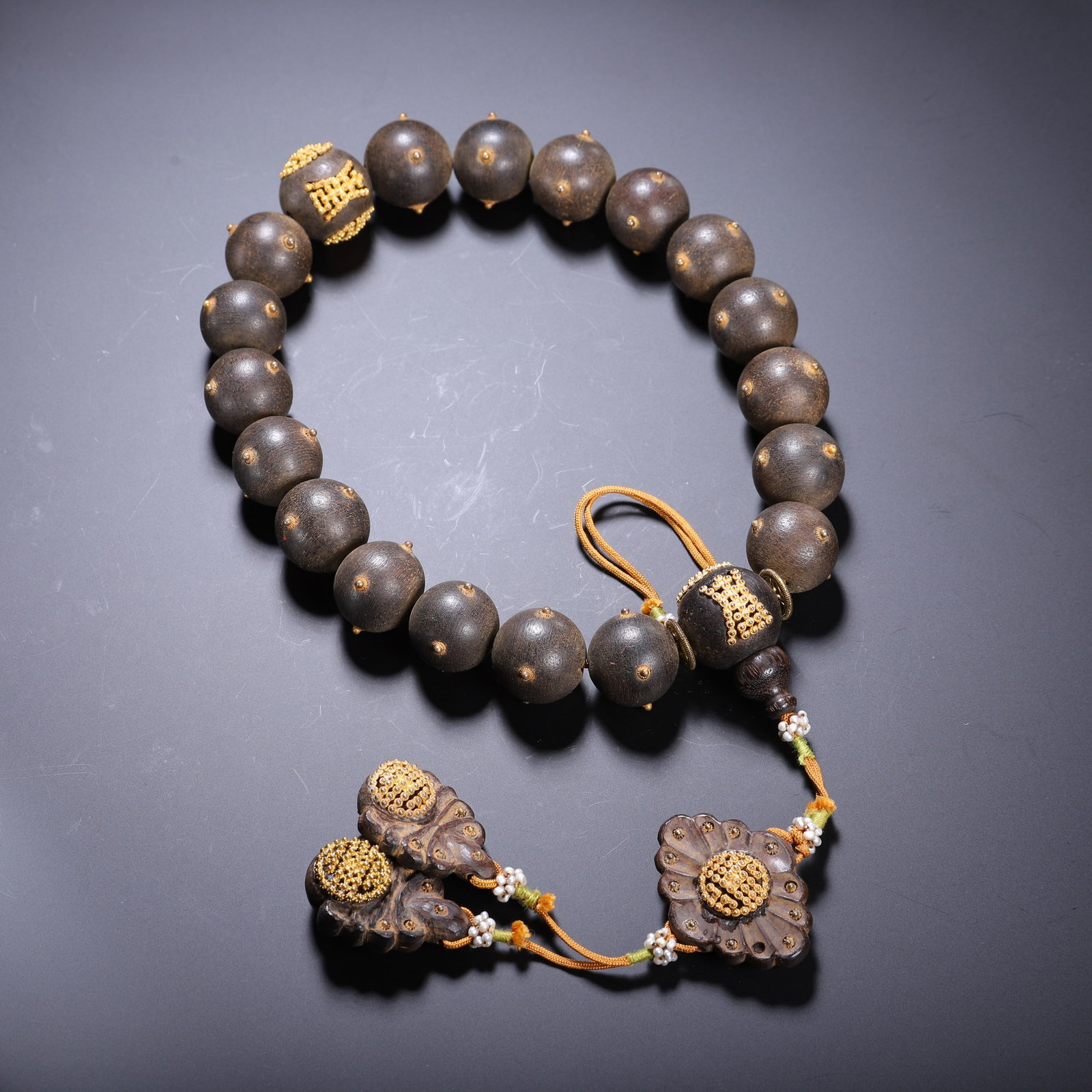 AN ALGUM WOOD PRAYER BEAD BRACELET: AN ALGUM WOOD PRAYER BEAD BRACELET Dimensions: Length: 1.8 cm (0.71 in.). Weight: 90 g. All measurements are approximate.