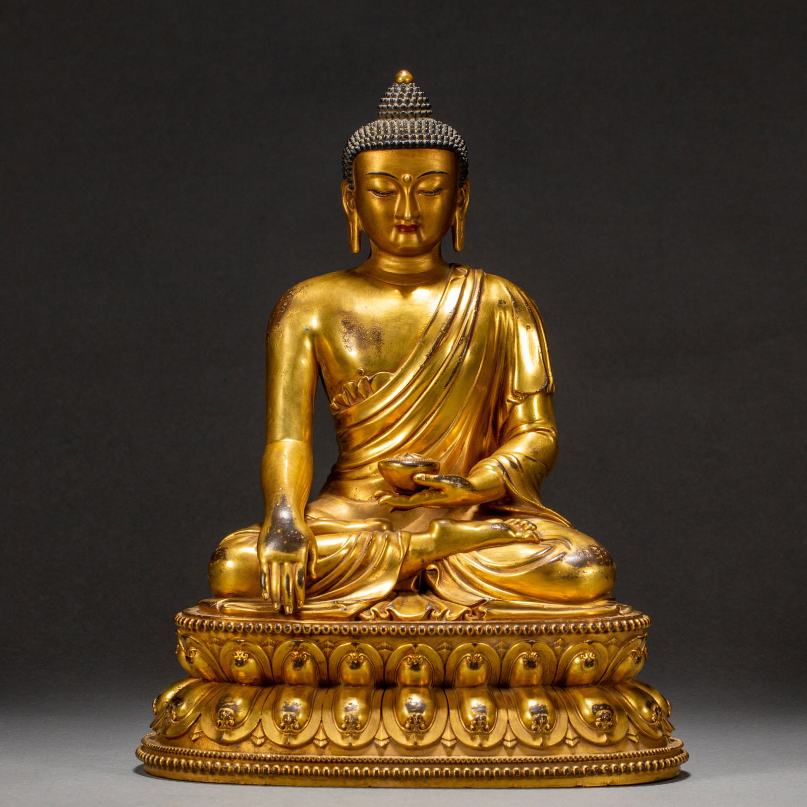 A GILT-BRONZE BUDDHA FIGURE (1 of 9)