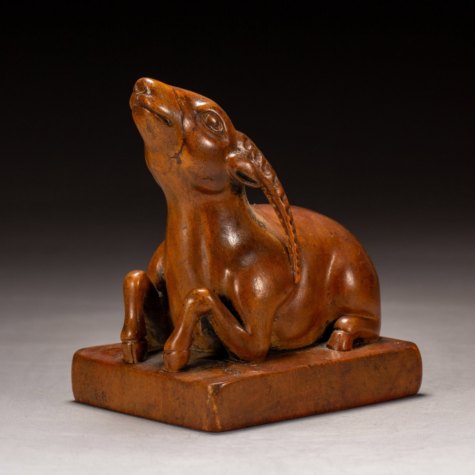 A SANDALWOOD SEAL: A SANDALWOOD SEAL Dimensions: Dimensions: Length: 8.5 cm (3.35 in.), Width: 7 cm (2.76 in.), Height: 10.5 cm (4.13 in.). Weight: 180 g. All measurements are approximate.