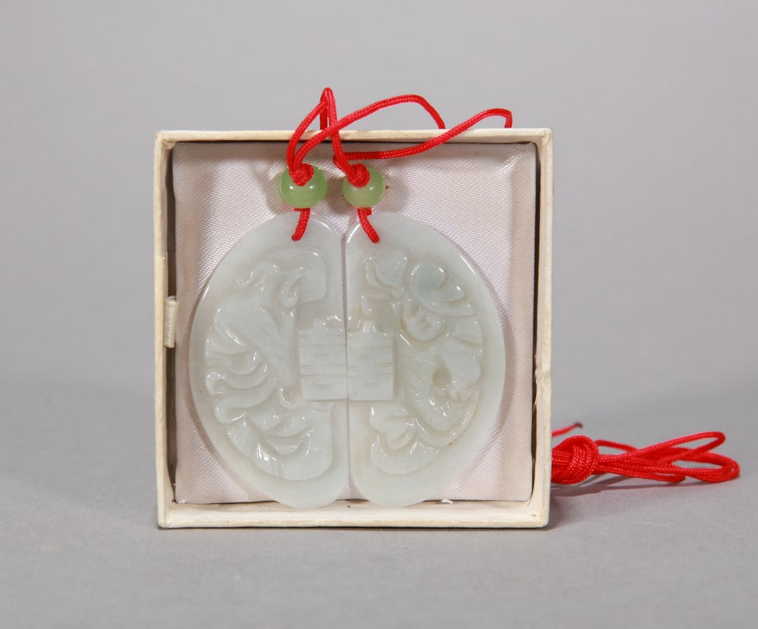 A JADEITE 'XI' PENDANT: A JADEITE 'XI' PENDANT Dimensions: Dimensions: Width: 4.7 cm (1.85 in.) x Height: 5 cm (1.97 in.). All measurements are approximate.