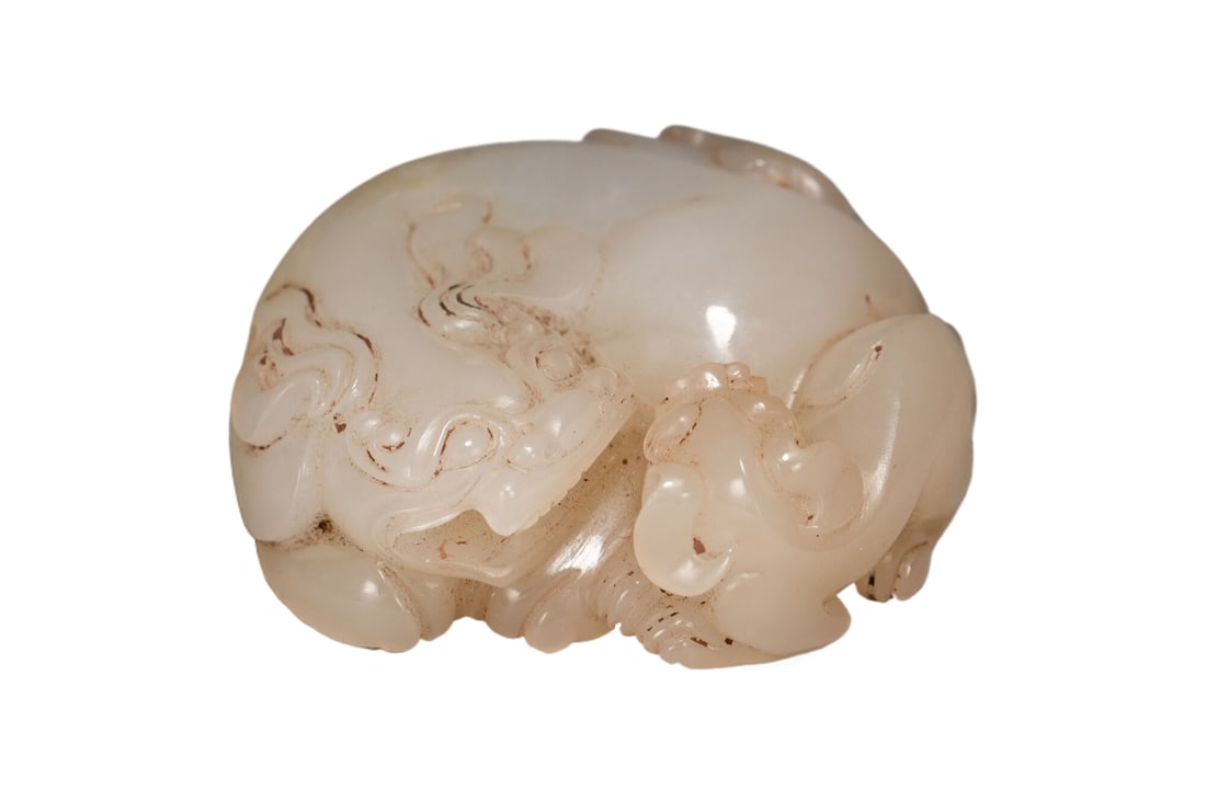 A HETIAN JADE BEAST: A HETIAN JADE BEAST Dimensions: Dimensions: Length: 5.5 cm (2.17 in.), Width: 5.5 cm (2.17 in.), Height: 1.8 cm (0.71 in.). Weight: 90 g. All measurements are approximate.