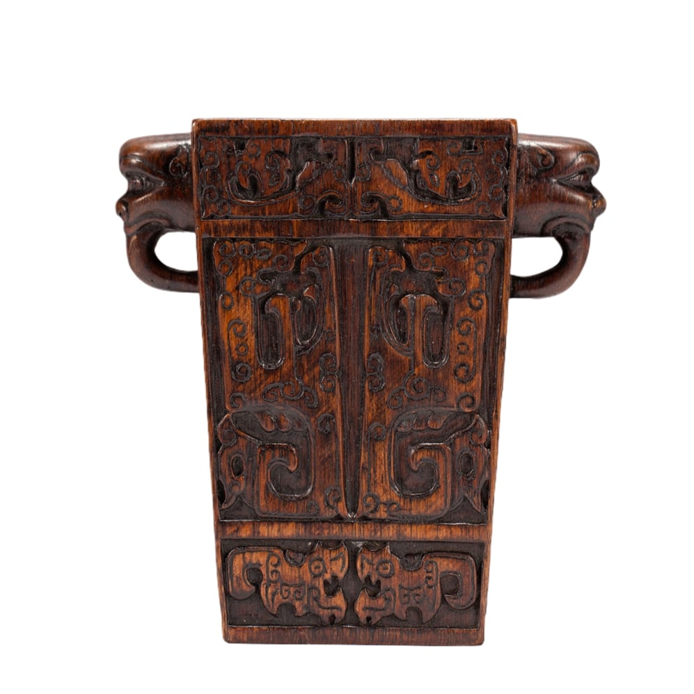 AN ALGUM WOOD BRUSH POT: AN ALGUM WOOD BRUSH POT Dimensions: Dimensions: Length: 12 cm (4.72 in.), Width: 6.8 cm (2.68 in.), Height: 13 cm (5.12 in.). Weight: 160 g. All measurements are approximate.