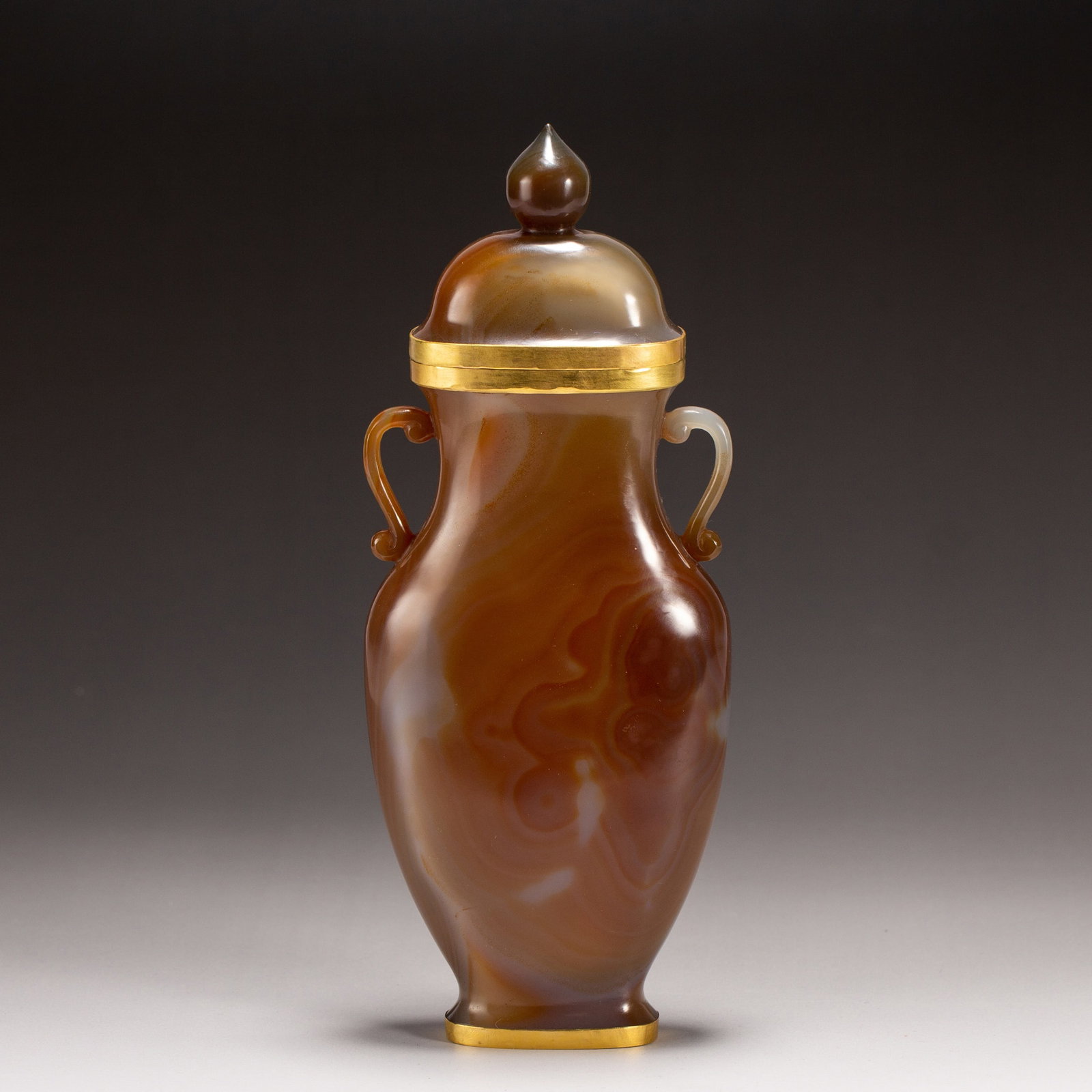 AN AGATE VASE: AN AGATE VASE Dimensions: Dimensions: Length: 8.5 cm (3.35 in.), Width: 3 cm (1.18 in.), Height: 22 cm (8.66 in.). Weight: 340 g. All measurements are approximate.