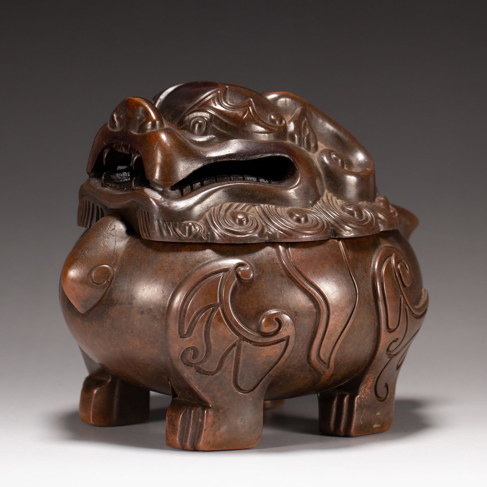 A BRONZE BEAST-FORM CENSER: A BRONZE BEAST-FORM CENSER Dimensions: Dimensions: Length: 13 cm (5.12 in.), Width: 11 cm (4.33 in.), Height: 11 cm (4.33 in.). Weight: 1470 g. All measurements are approximate.