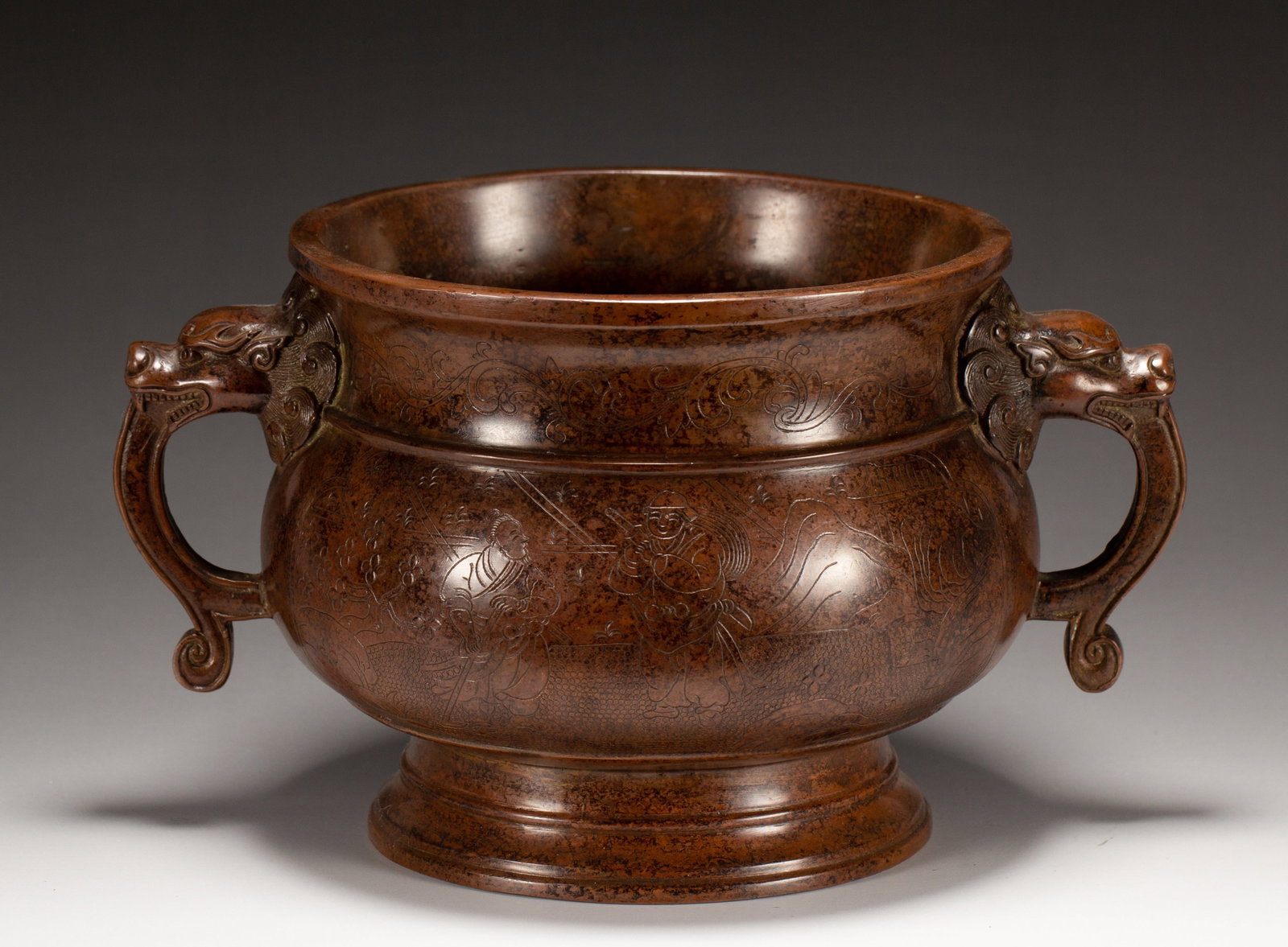 A BRONZE DOUBLE-HANDLE CENSER: A BRONZE DOUBLE-HANDLE CENSER Dimensions: Dimensions: Length: 22 cm (8.66 in.), Width: 15 cm (5.91 in.), Height: 23 cm (9.06 in.). Weight: 2120 g. All measurements are approximate.