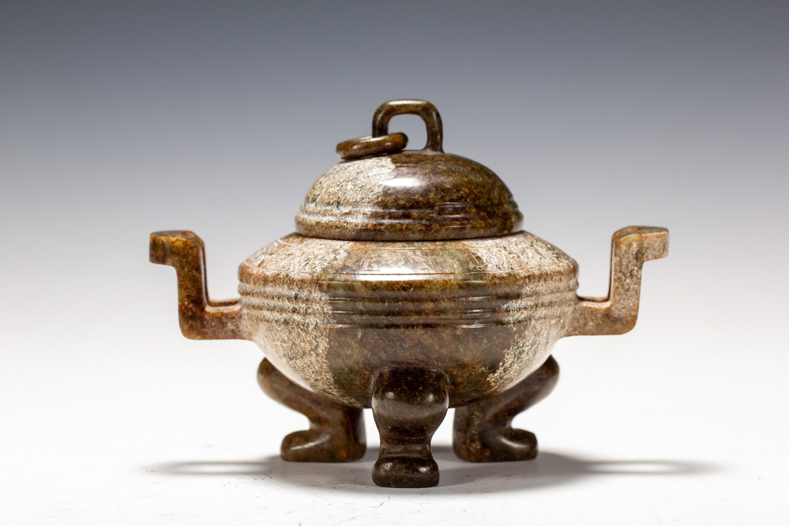 AN ARCHAIC JADE TRIPOD CENSER (1 of 9)