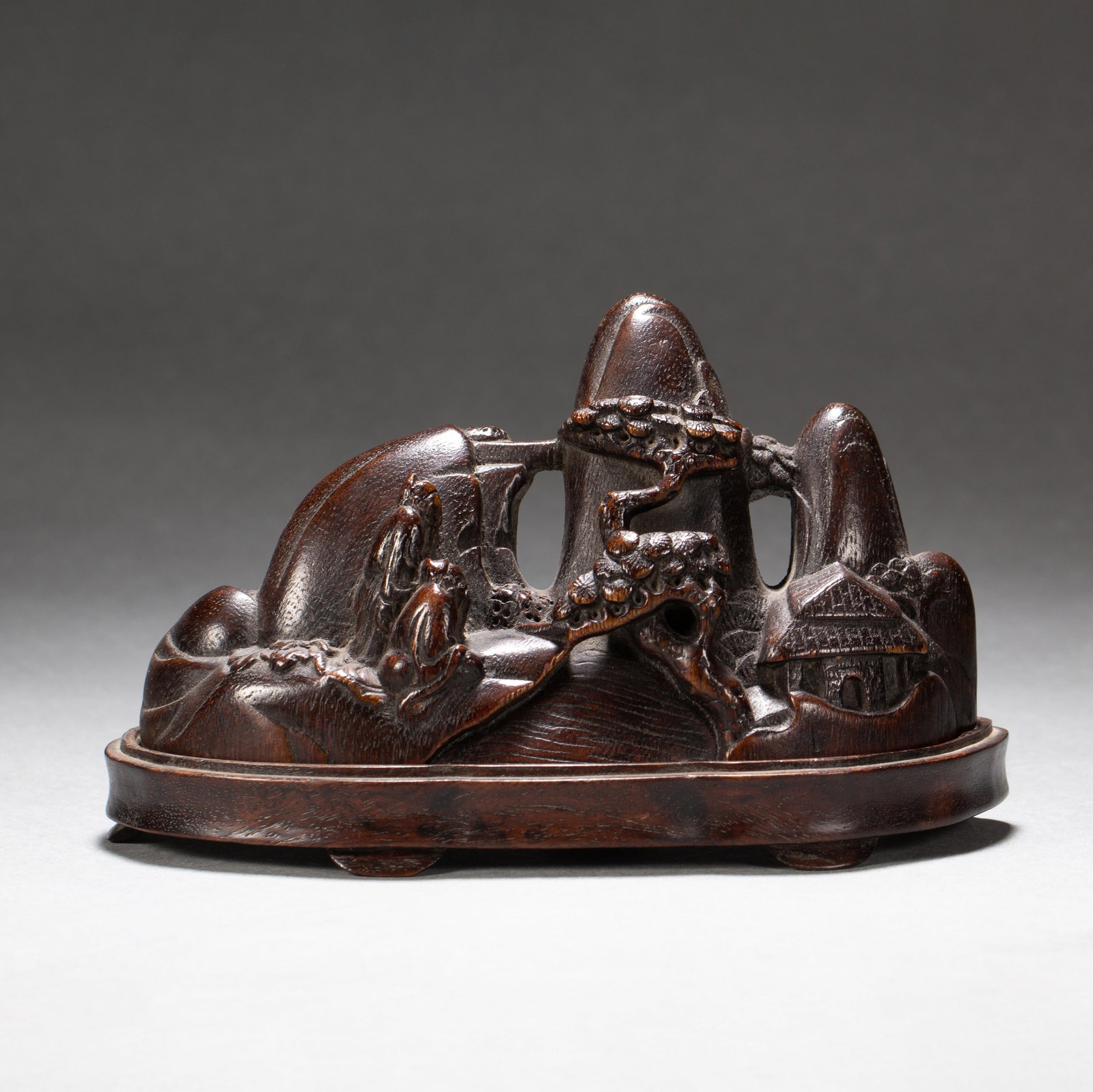 A WOOD CARVED 'FIGURES' BRUSH REST: A WOOD CARVED 'FIGURES' BRUSH REST Dimensions: Dimensions: Length: 15.5 cm (6.10 in.), Width: 5 cm (1.97 in.), Height: 9 cm (3.54 in.). Weight: 160 g. All measurements are approximate.