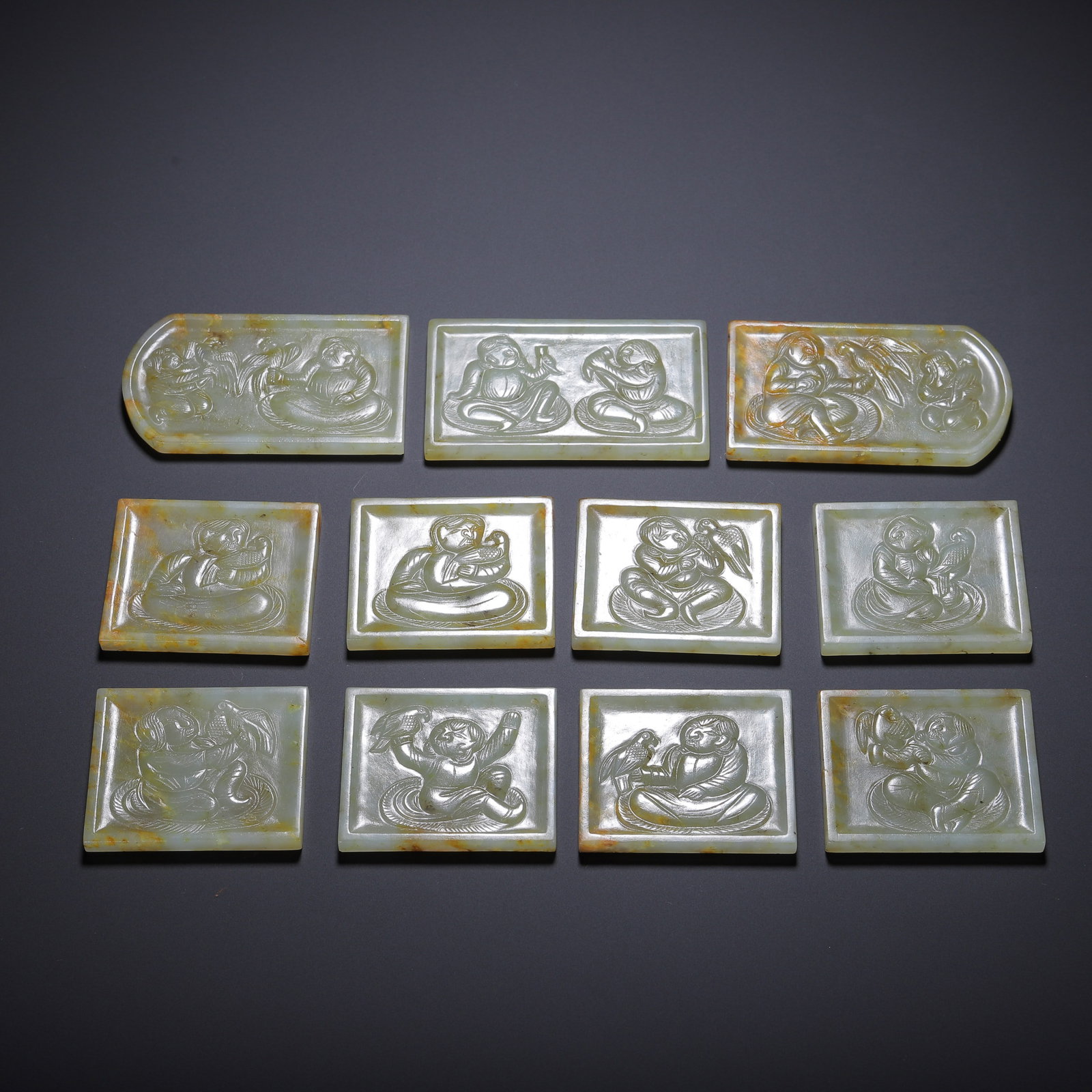 A HETIAN JADE BELT PLAQUE: A HETIAN JADE BELT PLAQUE Dimensions: Dimensions: Length: 7 cm (2.76 in.), Width: 4 cm (1.57 in.). All measurements are approximate.