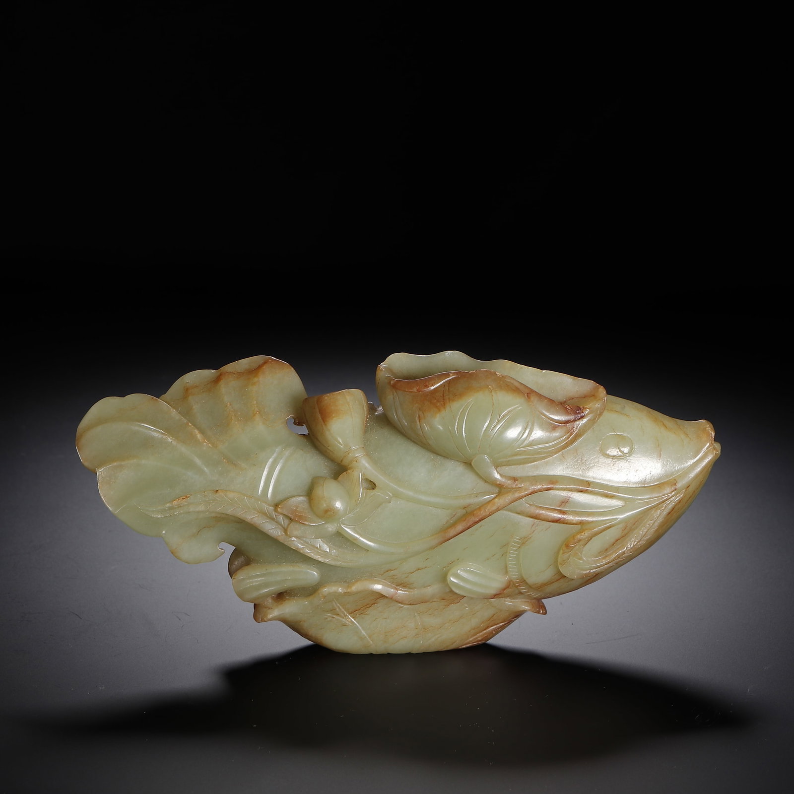 A HETIAN JADE FISH: A HETIAN JADE FISH Dimensions: Dimensions: Length: 10 cm (3.94 in.), Width: 7 cm (2.76 in.), Height: 8 cm (3.15 in.). Weight: 530 g. All measurements are approximate.