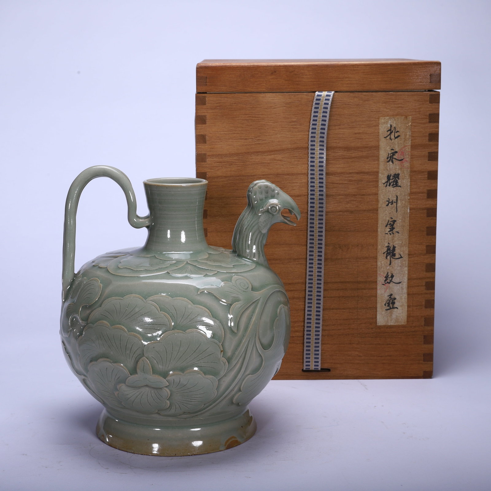 A YAOZHOU EWER: A YAOZHOU EWER Dimensions: Dimensions: Length: 18 cm (7.09 in.), Width: 18 cm (7.09 in.), Height: 21.5 cm (8.46 in.). Weight: 1120 g. All measurements are approximate.