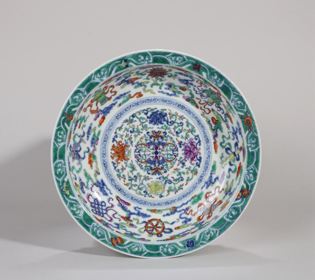 A DOUCAI 'EIGHT BUDDHIST EMBLEMS AND FLOWERS' DISH (1 of 10)
