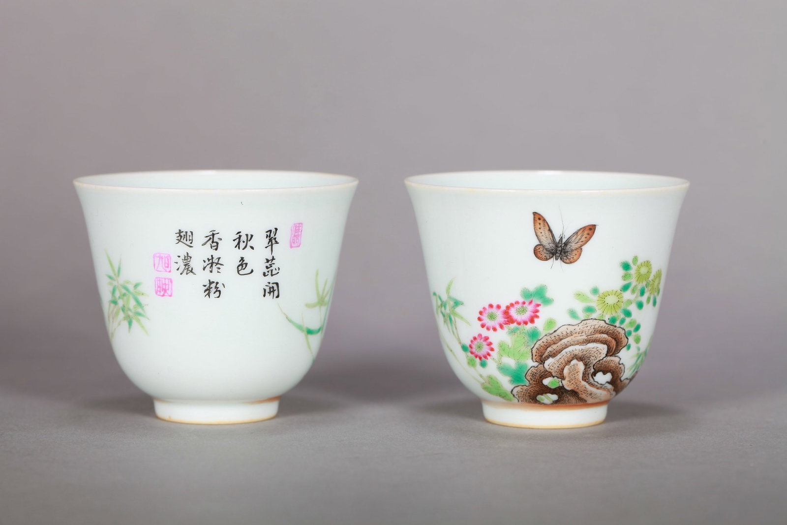 A PAIR OF FAMILLE ROSE 'FLOWERS, BUTTERFLIES AND POETRY' CUP: A PAIR OF FAMILLE ROSE 'FLOWERS, BUTTERFLIES AND POETRY' CUP Dimensions: Length: 6.5 cm (2.56 in.), Width: 6.5 cm (2.56 in.), Height: 5.5 cm (2.17 in.). All measurements are approximate.