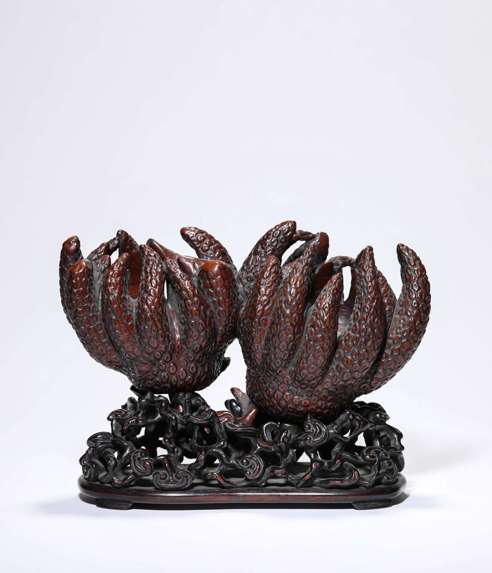 A WOOD CARVED 'BUDDHA HAND' ORNAMENT: A WOOD CARVED 'BUDDHA HAND' ORNAMENT Dimensions: Length: 20.5 cm (8.07 in.), Width: 8.9 cm (3.50 in.), Height: 12.8 cm (5.04 in.). All measurements are approximate.