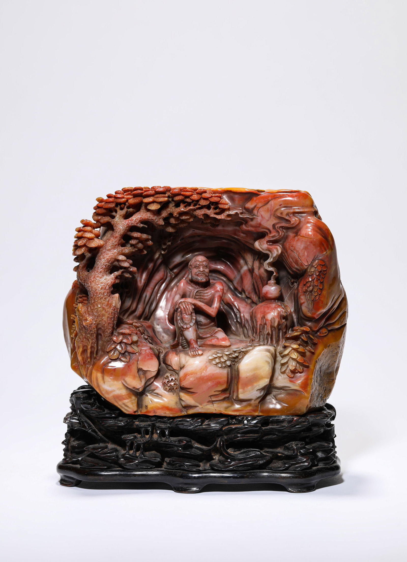 A SHOUSHAN STONE CARVED LUOHAN FIGURE: A SHOUSHAN STONE CARVED LUOHAN FIGURE Dimensions: Length: 17.3 cm (6.81 in.), Width: 10 cm (3.94 in.), Height: 13.8 cm (5.43 in.). All measurements are approximate.