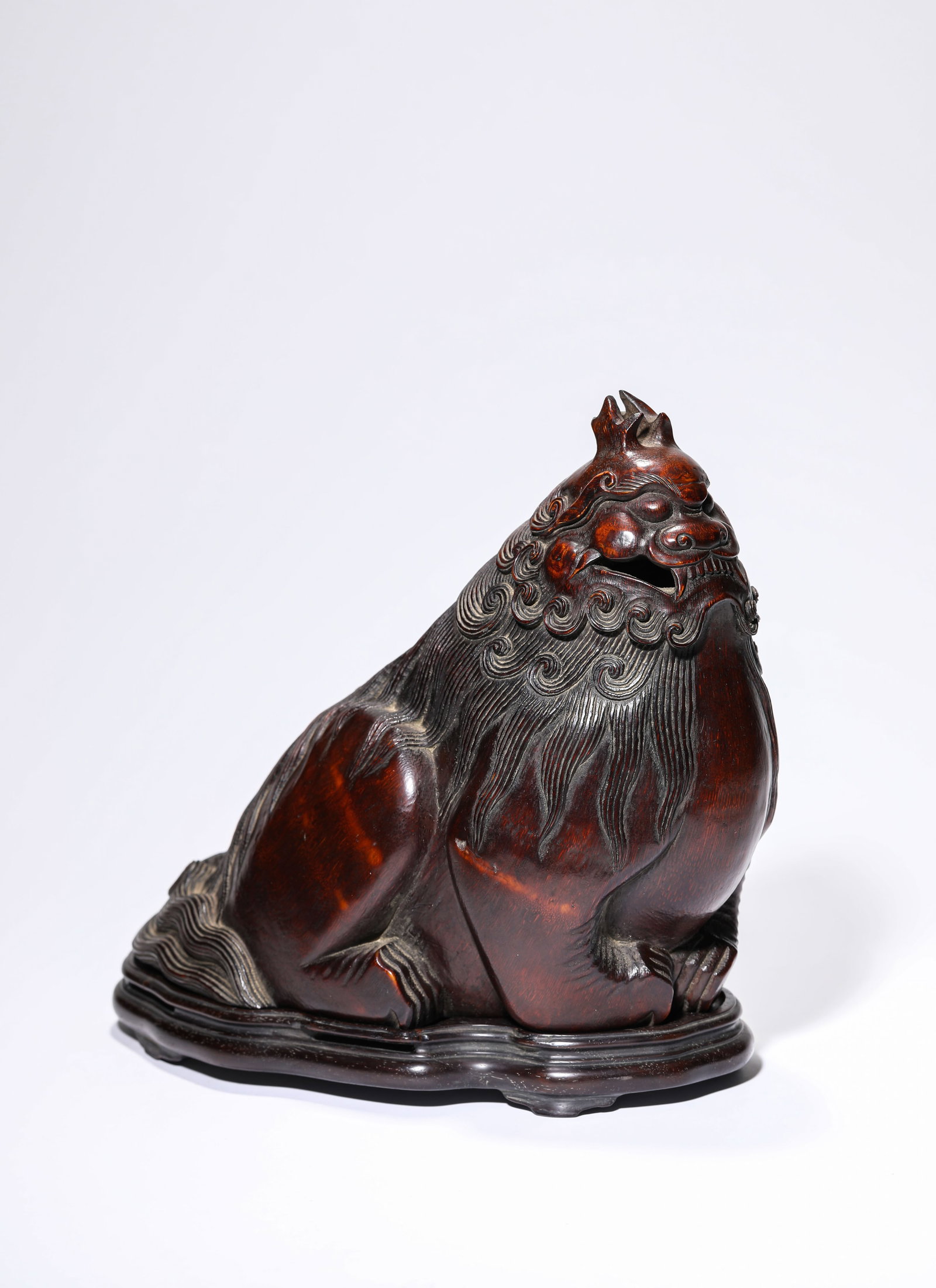 A BAMBOO CARVED 'AUSPICIOUS BEAST' INCENSE BURNER: A BAMBOO CARVED 'AUSPICIOUS BEAST' INCENSE BURNER Dimensions: Length: 23 cm (9.06 in.), Width: 15 cm (5.91 in.), Height: 23.5 cm (9.25 in.). All measurements are approximate.