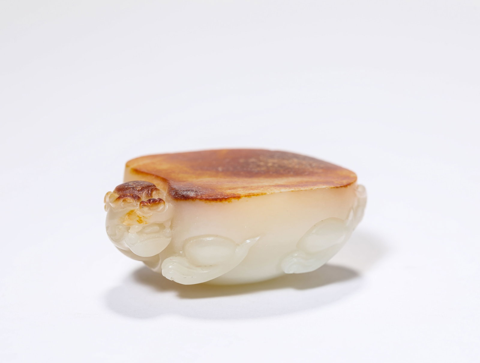 A JADE CARVED TORTOISE PAPERWEIGHT: A JADE CARVED TORTOISE PAPERWEIGHT Dimensions: Length: 4.8 cm (1.89 in.), Width: 3.5 cm (1.38 in.), Height: 2 cm (0.79 in.). All measurements are approximate.